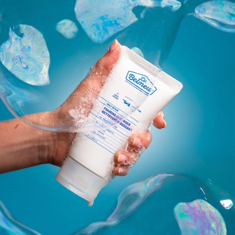 Dr. Belmeur Daily Repair Foaming Cleanser 150ml - mild pH-balanced foaming cleanser with birch extract and panthenol for sensitive skin. Image of product in hand with foam.