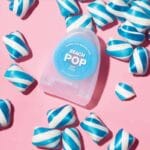 REACH POP dental floss mint - vegan, waxed dental floss with 384 micro threads & sustainable packaging, 50m. Picture mint candy flavor. 