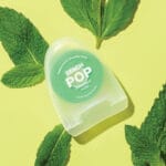18230992 REACH POP dental floss Peppermint Floss - vegan, waxed dental floss with 384 micro threads & sustainable packaging, 50m, peppermint flavor. Picture peppermint flavor. 